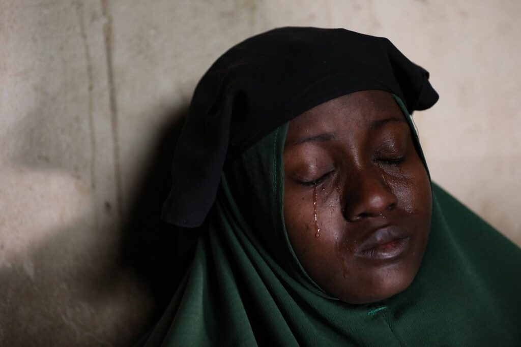 Il volto di una madre nigeriana sconvolta dalle violenze di Boko Haram nel gennaio 2021. Lo scatto è di Sodiq Adelakun Adekola, Agence France-Presse